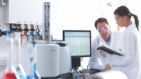 Corrective Maintenance Illustration Technicians looking at tests results